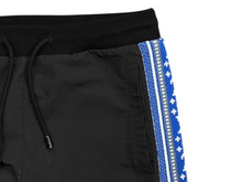 Load image into Gallery viewer, LOUIS VUITTON ルイ ヴィトン トラックパンツ RM231M ニット ナイロン 23SS LV ロゴ モノグラム フェアアイル 美品 中古 4b010012